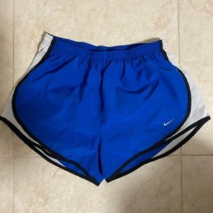 THREE PAIRS OF NIKE RUNNING SHORTS